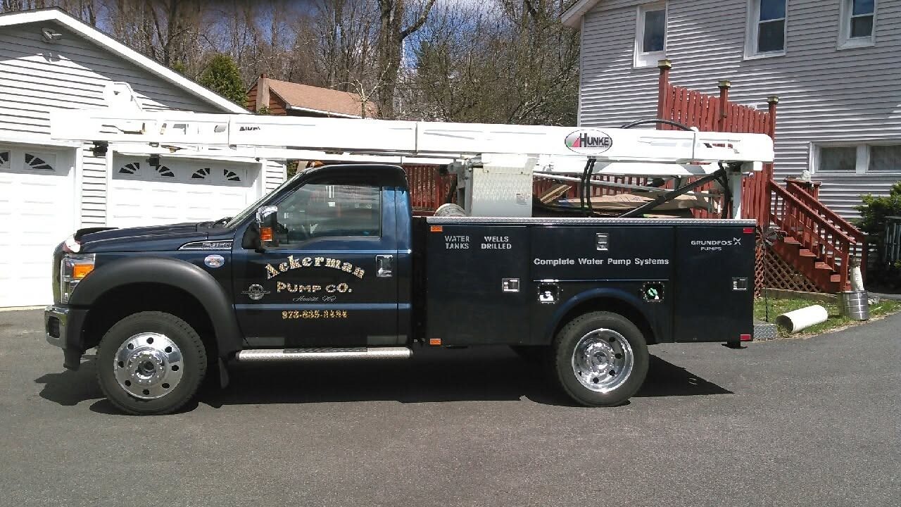 Ackerman Pump Company service truck at a job